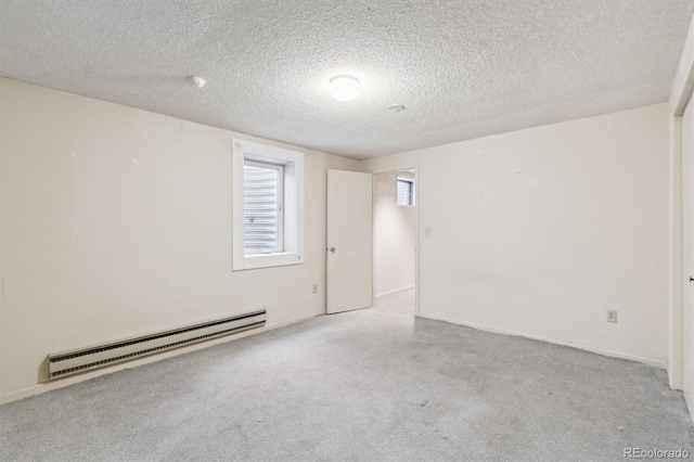 14333 E Warren Pl, Aurora, CO 80014 - unfurnished room with baseboard heating, carpet, and a textured ceiling