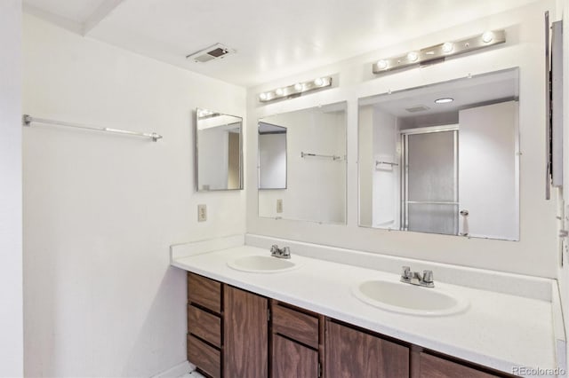 14333 E Warren Pl, Aurora, CO 80014 - full bathroom with double vanity and a shower with shower door
