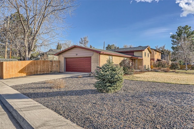 ranch-style house featuring a garage