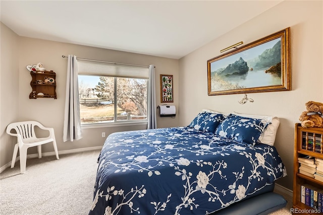 bedroom with carpet floors and baseboards