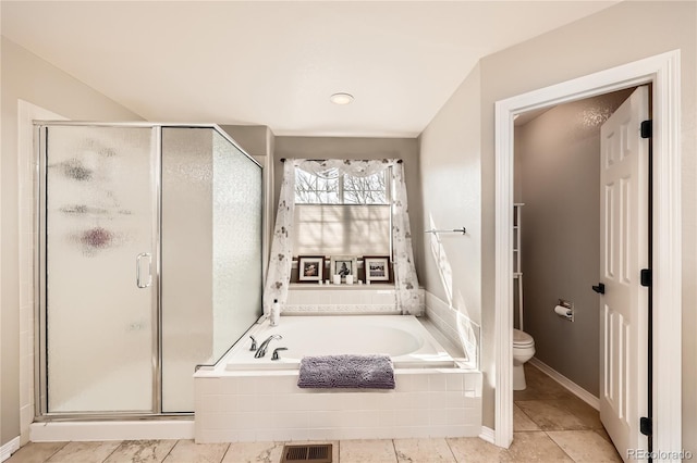 bathroom featuring a bath, toilet, a shower stall, and visible vents