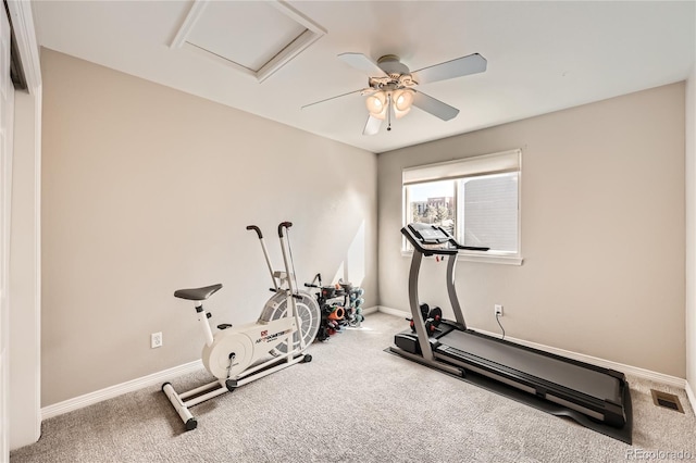 workout room featuring attic access, carpet, visible vents, and baseboards