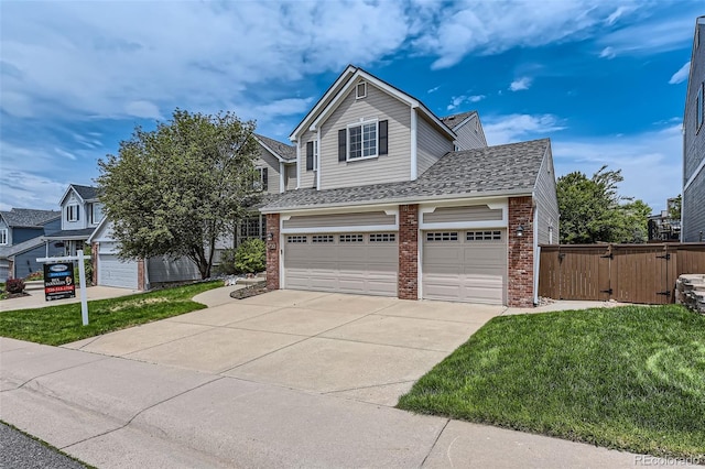 3416 Hawthorne Dr, Highlands Ranch, CO 80126 - view of front of house featuring brick siding, concrete driveway, a gate, a garage, and a shingled roof