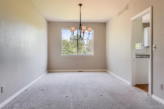 3416 Hawthorne Dr, Highlands Ranch, CO 80126 - carpeted spare room with a chandelier, a textured wall, and baseboards