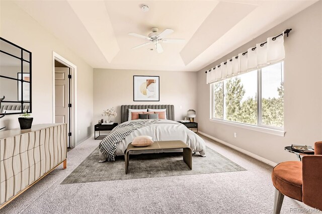 3416 Hawthorne Dr, Highlands Ranch, CO 80126 - bedroom featuring light carpet, a tray ceiling, baseboards, and ceiling fan