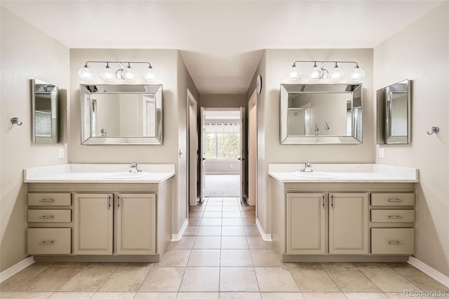 3416 Hawthorne Dr, Highlands Ranch, CO 80126 - bathroom with two vanities, baseboards, and tile patterned floors