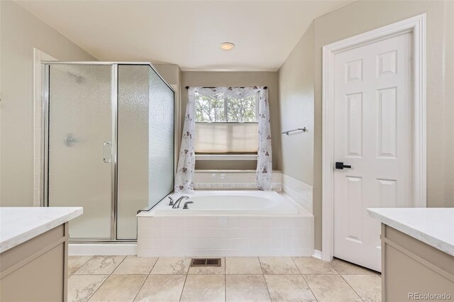 3416 Hawthorne Dr, Highlands Ranch, CO 80126 - bathroom featuring vanity, a shower stall, a garden tub, and tile patterned floors