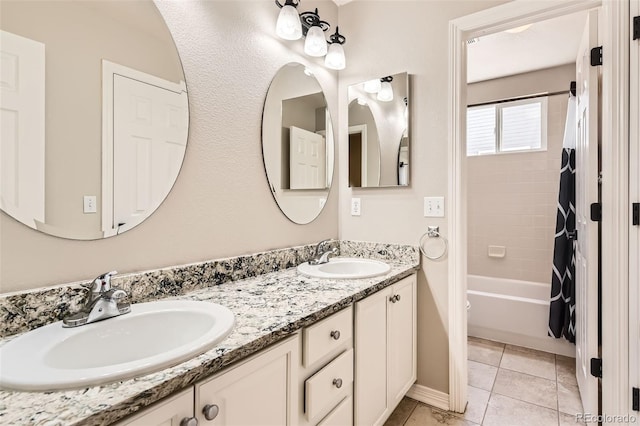 3416 Hawthorne Dr, Highlands Ranch, CO 80126 - full bathroom featuring double vanity, shower / bath combo with shower curtain, and tile patterned floors
