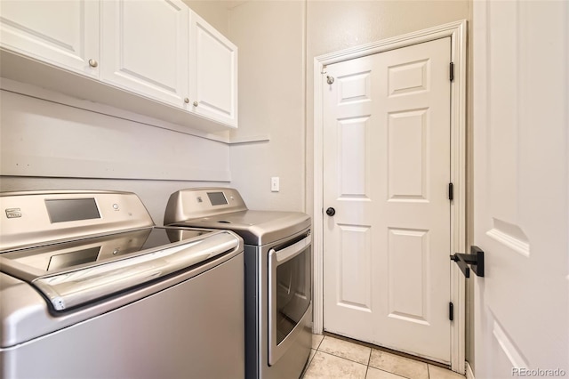 3416 Hawthorne Dr, Highlands Ranch, CO 80126 - laundry room with cabinet space, washer and dryer, and light tile patterned floors