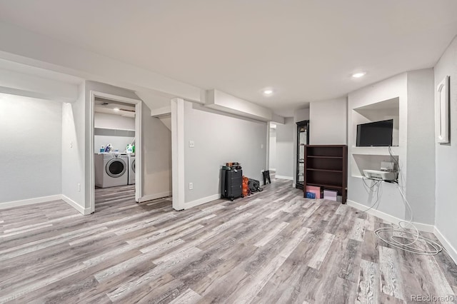 finished below grade area with recessed lighting, baseboards, wood finished floors, and independent washer and dryer