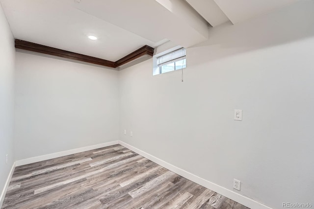 basement with wood finished floors and baseboards