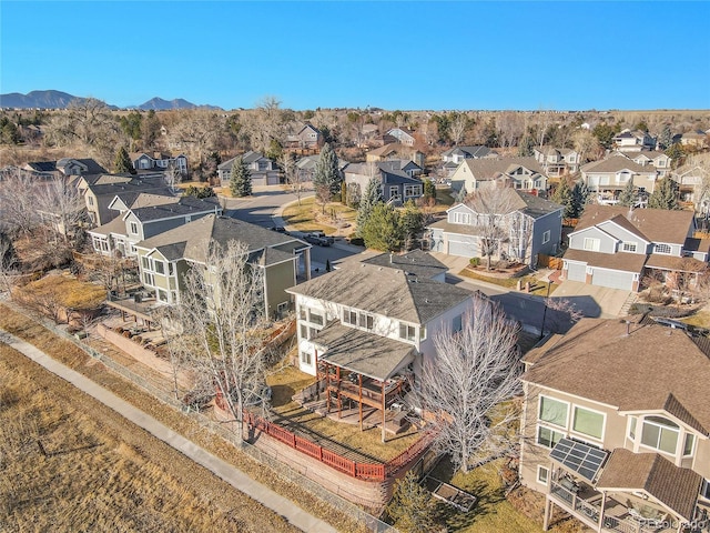 birds eye view of property with a mountain view