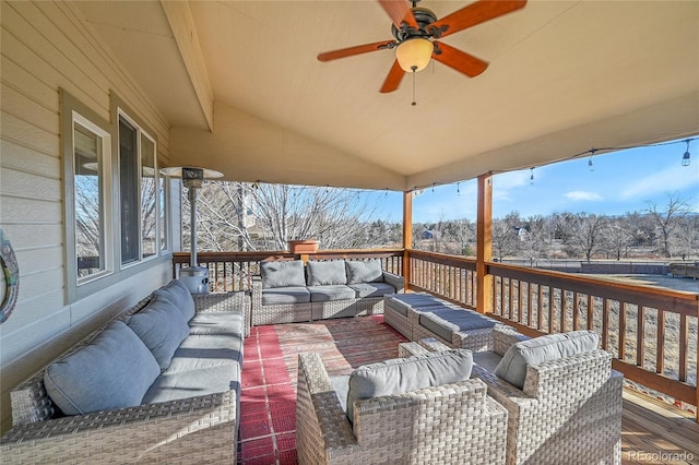 deck featuring ceiling fan and an outdoor hangout area