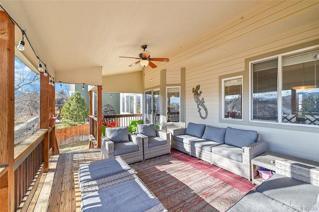 view of patio / terrace with outdoor lounge area, a deck, and ceiling fan