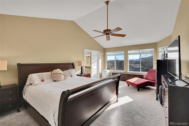 carpeted bedroom with ceiling fan and vaulted ceiling