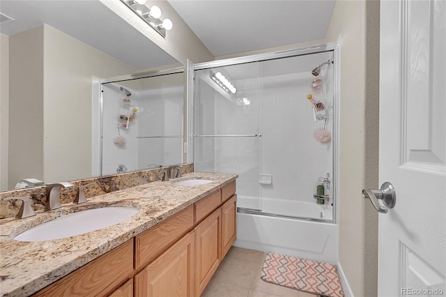 bathroom featuring tile patterned floors, vanity, and shower / bath combination with glass door