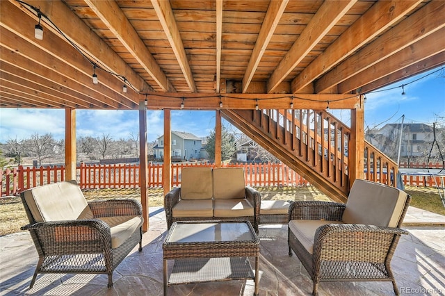 exterior space with beamed ceiling and wooden ceiling