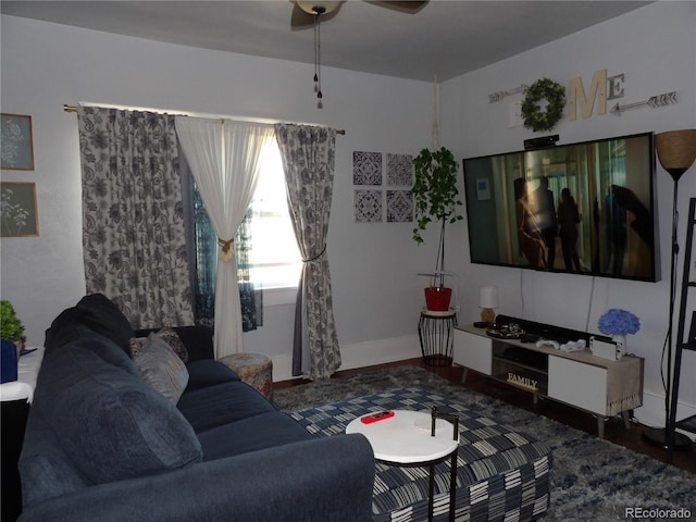 7651 State Highway 194, Las Animas, CO 81054 - living room featuring a ceiling fan, wood finished floors, and baseboards