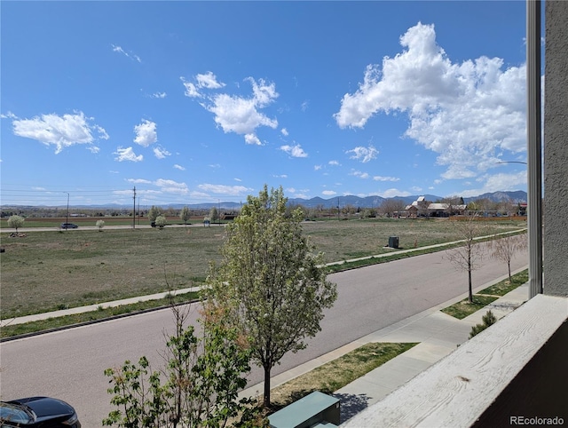mountain view featuring a rural view