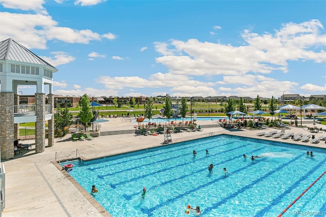 view of swimming pool with a patio