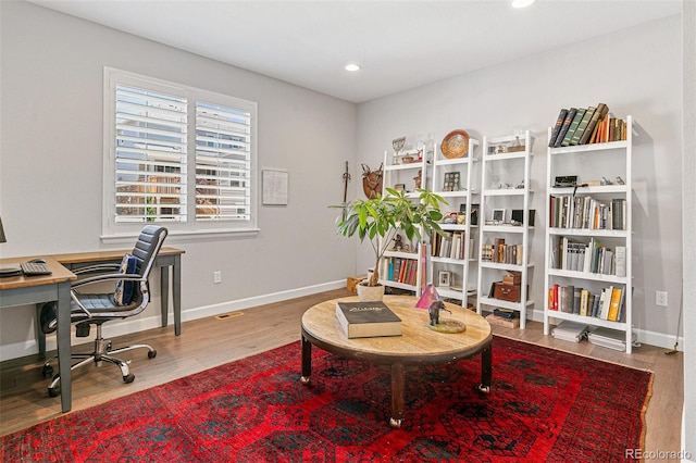 office space with hardwood / wood-style floors