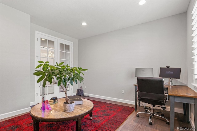 office with hardwood / wood-style floors and french doors