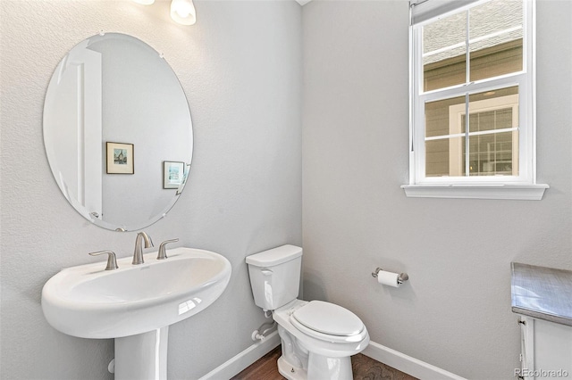 bathroom with toilet and sink