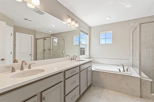 bathroom featuring vanity, tile patterned floors, and independent shower and bath