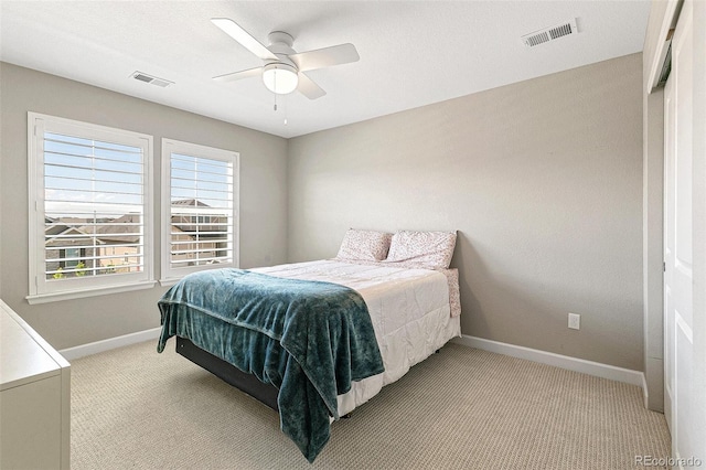 carpeted bedroom with ceiling fan