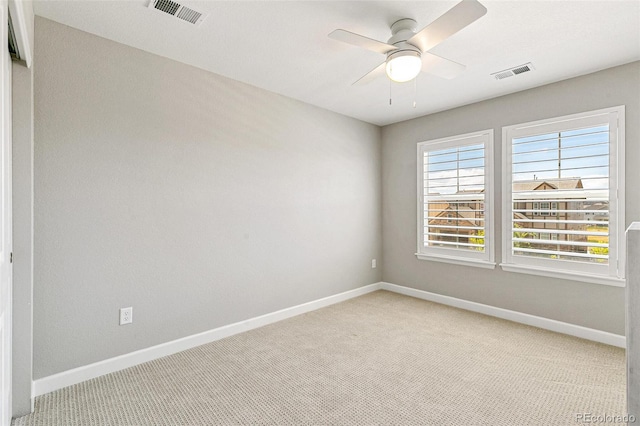 carpeted empty room with ceiling fan