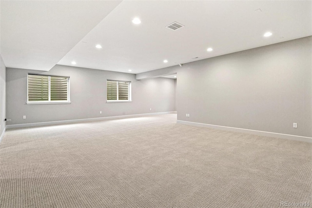 empty room featuring light carpet