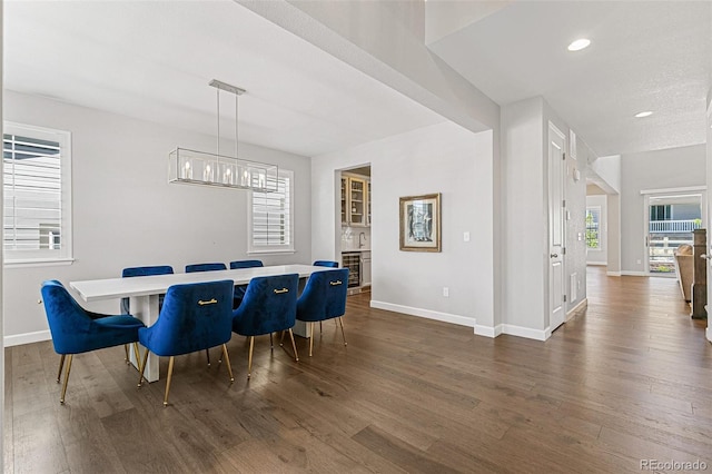 dining space featuring dark hardwood / wood-style floors