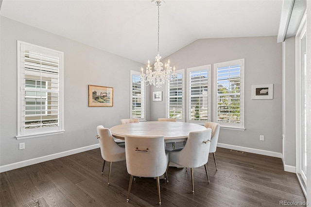 dining area with dark hardwood / wood-style floors, lofted ceiling, and an inviting chandelier