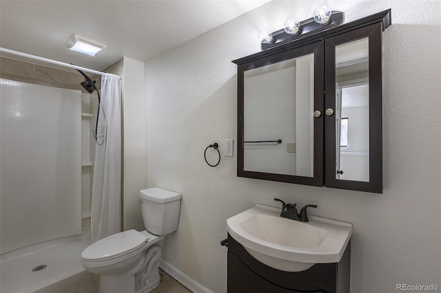 bathroom featuring a stall shower, a textured wall, toilet, tile patterned floors, and vanity