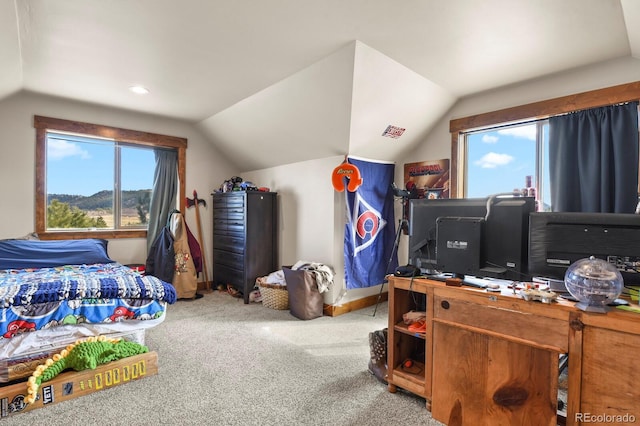 bedroom with carpet, multiple windows, and vaulted ceiling