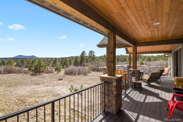 wooden terrace with a mountain view