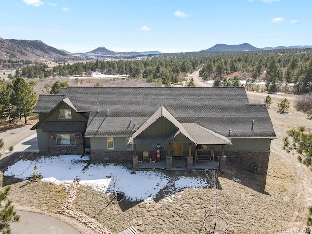 birds eye view of property featuring a mountain view