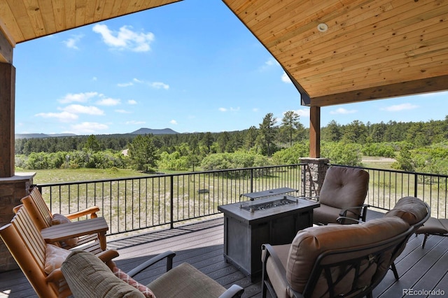5800 Elk View Ct, Larkspur, CO 80118 - wooden deck with a view of trees and a fire pit