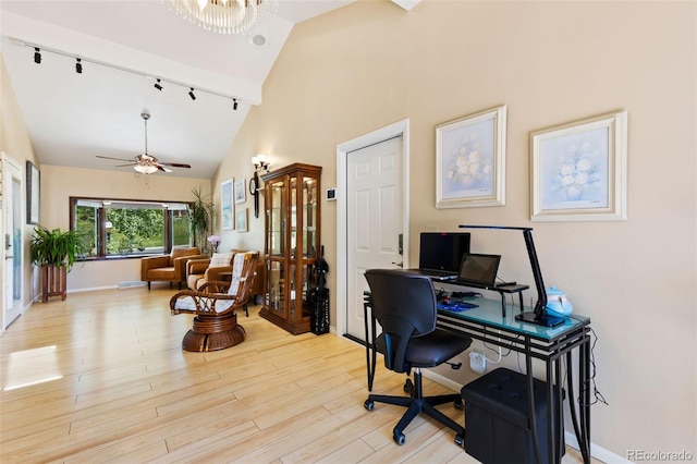 9598 Lowell Blvd, Westminster, CO 80031 - home office featuring rail lighting, ceiling fan, high vaulted ceiling, light wood-style floors, and baseboards