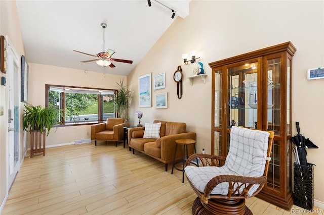 9598 Lowell Blvd, Westminster, CO 80031 - living area with rail lighting, ceiling fan, wood finished floors, french doors, and high vaulted ceiling