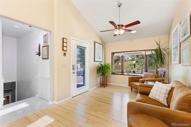 9598 Lowell Blvd, Westminster, CO 80031 - living room featuring ceiling fan, light wood-style floors, baseboards, and high vaulted ceiling