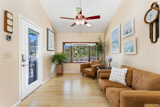 9598 Lowell Blvd, Westminster, CO 80031 - living area with vaulted ceiling, a ceiling fan, light wood finished floors, healthy amount of natural light, and baseboards