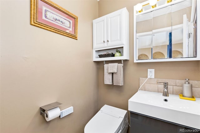 9598 Lowell Blvd, Westminster, CO 80031 - half bathroom featuring vanity and toilet