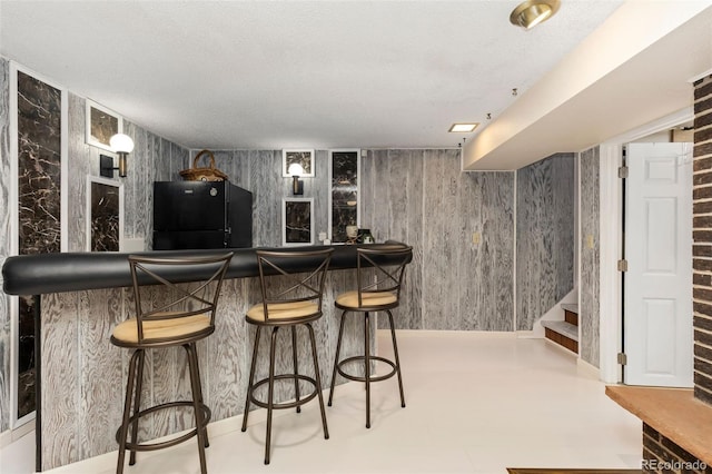 9598 Lowell Blvd, Westminster, CO 80031 - indoor bar featuring fridge, stairway, and a textured ceiling