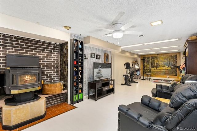 9598 Lowell Blvd, Westminster, CO 80031 - living room with a ceiling fan, a wood stove, and a textured ceiling
