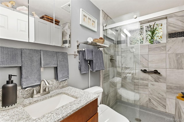 9598 Lowell Blvd, Westminster, CO 80031 - bathroom featuring vanity, toilet, and a stall shower