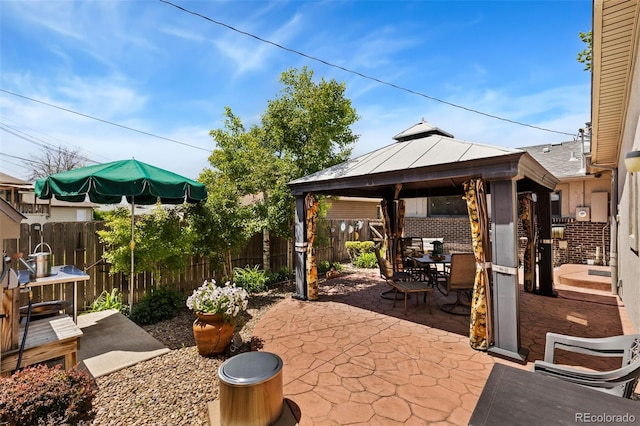 9598 Lowell Blvd, Westminster, CO 80031 - fenced backyard with a gazebo, outdoor dining area, and a patio area