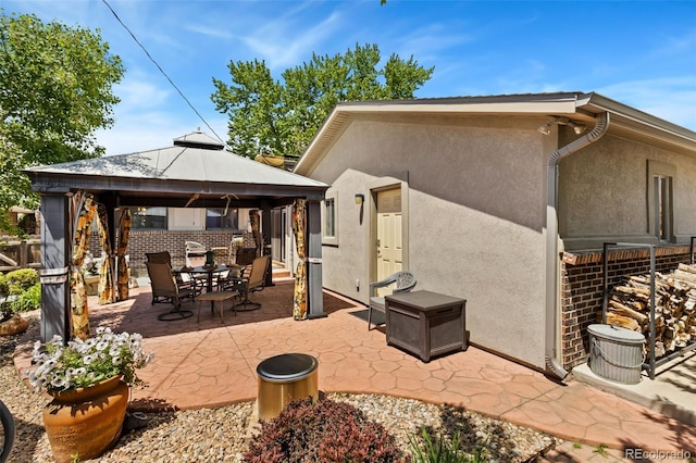 9598 Lowell Blvd, Westminster, CO 80031 - view of patio featuring a gazebo and outdoor dining space