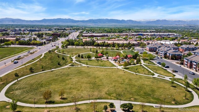 9598 Lowell Blvd, Westminster, CO 80031 - aerial overview of property's location featuring a mountainous background and nearby suburban area