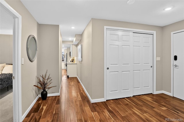 909 N Logan St Unit 1B, Denver, CO 80203 - corridor featuring dark wood-style flooring and recessed lighting